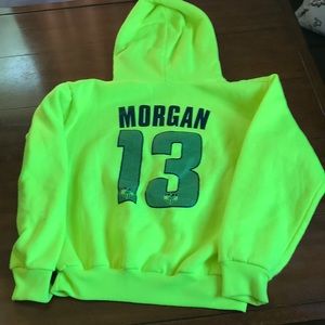Alex Morgan bright yellow sweatshirt